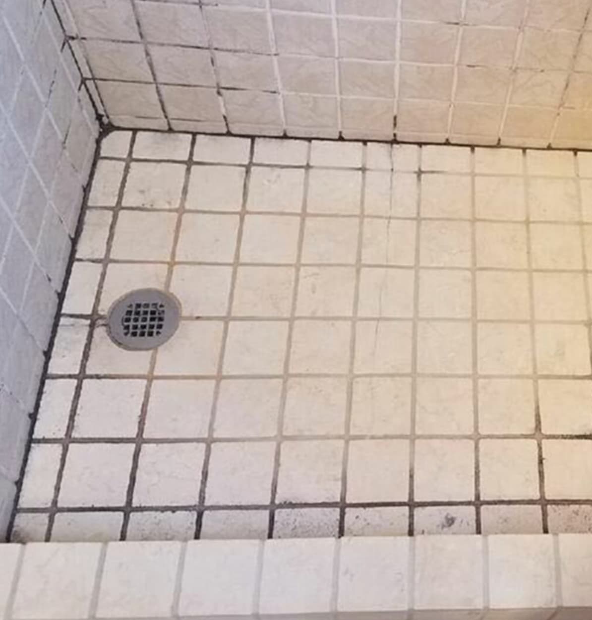 Bathroom tile and grout mould before professional removal — Camden London tenant property