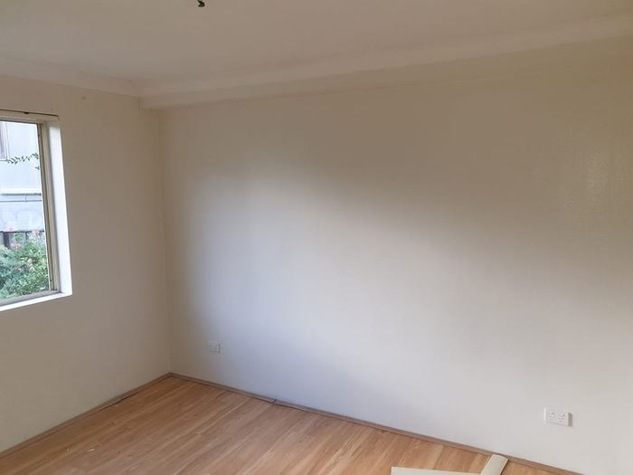 Clean family bedroom walls after professional residential mould removal — Islington London